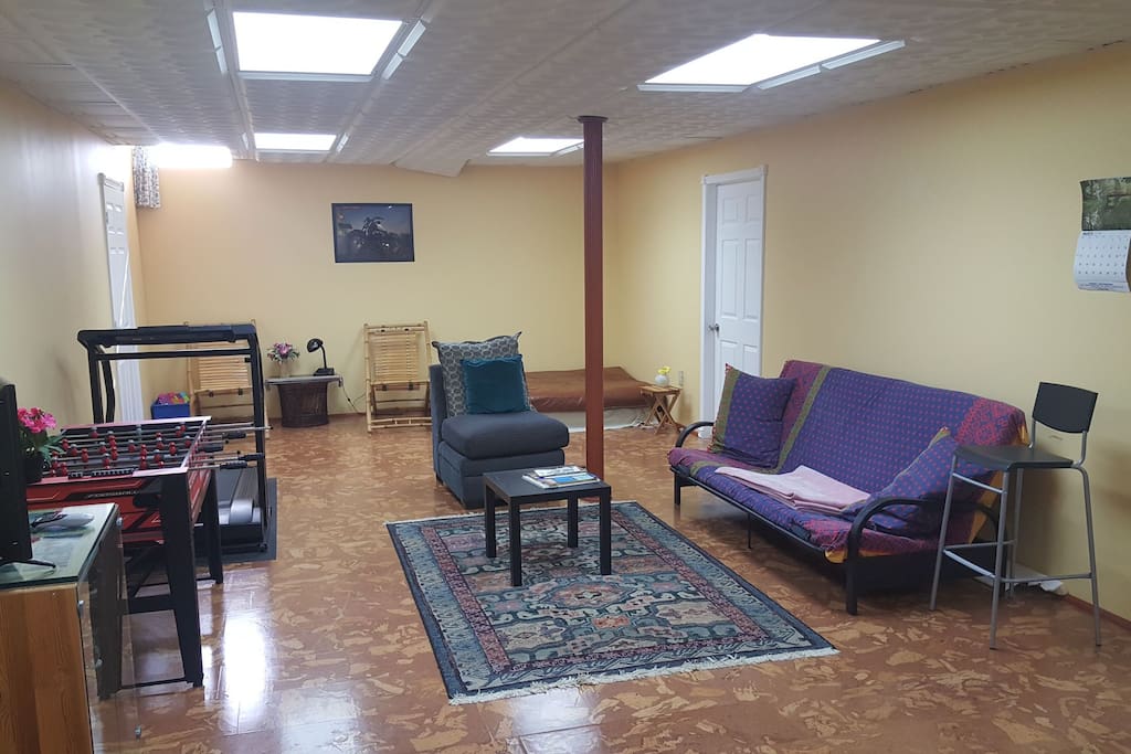 Living room, Couch, sofa bed, TV, Foosball, Exercise treadmill and spare bed