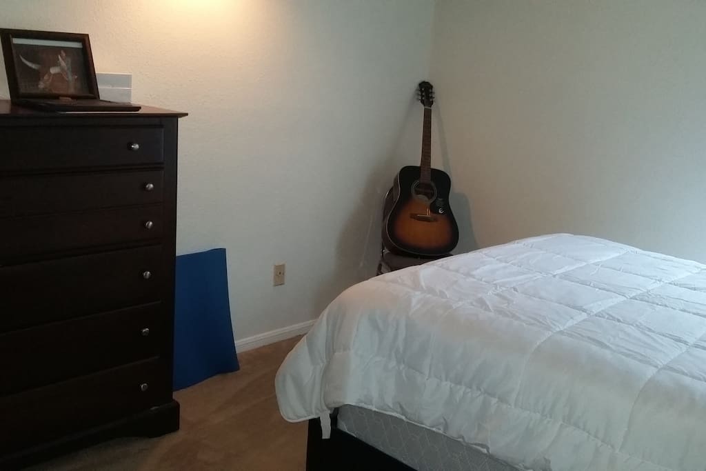 Master Bedroom with Yoga Mate and Guitar