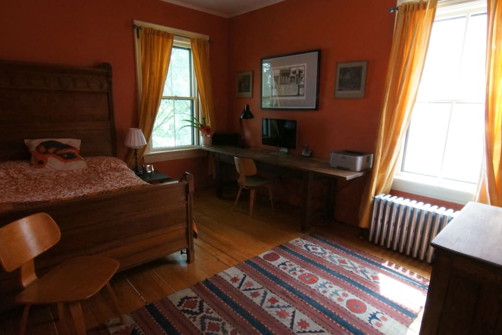 Corner bedroom overlooking garden.