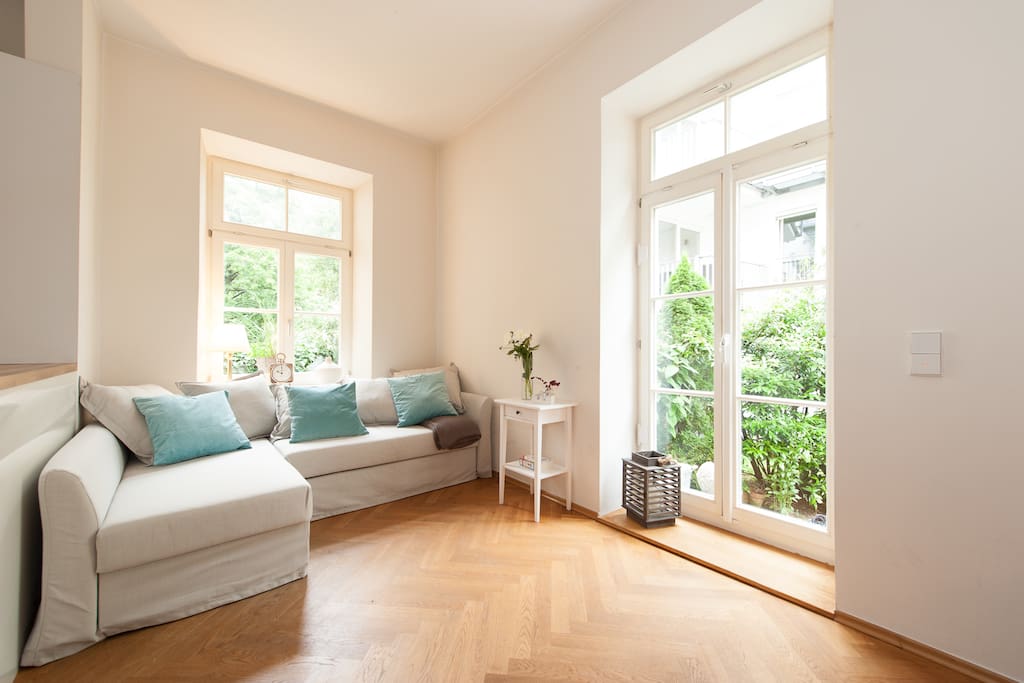 Enjoy the sunny living area with direct access to the garden.