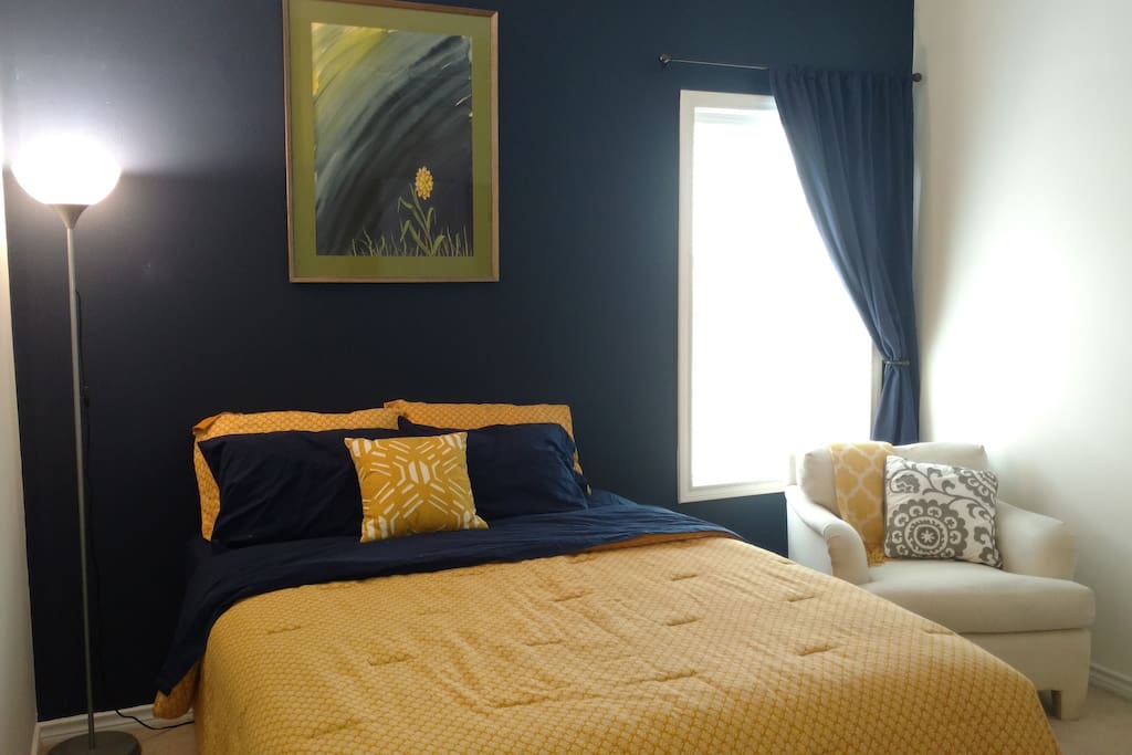 A comfortable queen bed and a black out curtain for your best night's sleep away from home.