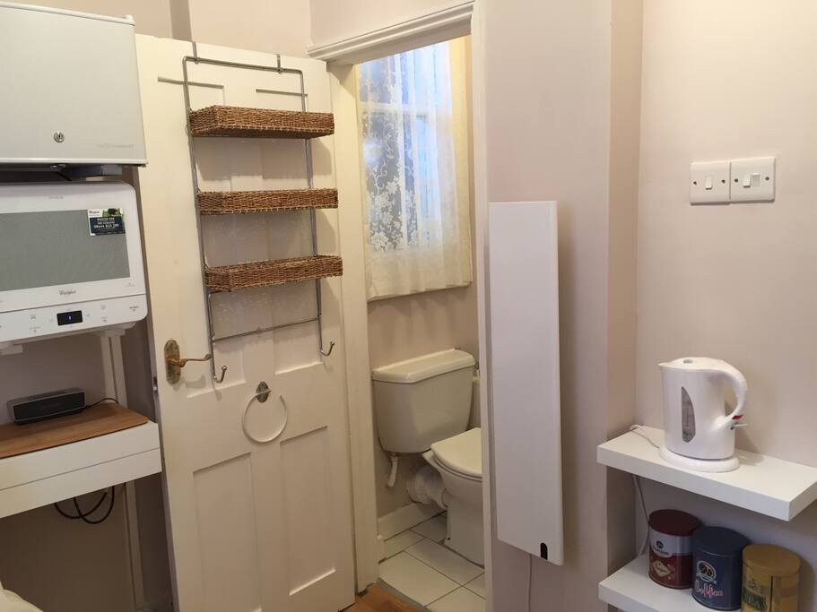 Microwave and mini fridge in the room, ensuite toilet and radiator for the cold nights.