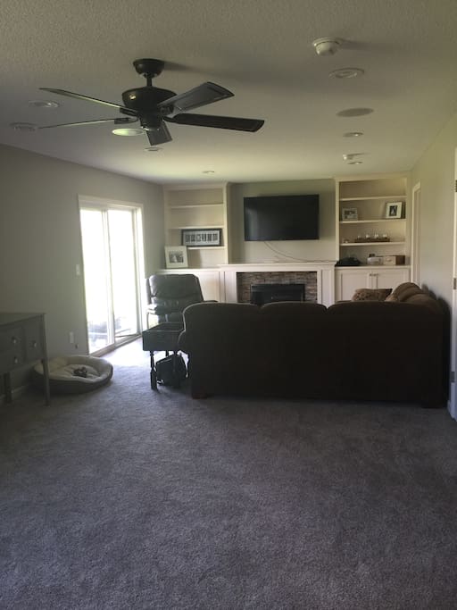 Large downstairs living room with full entertainment center