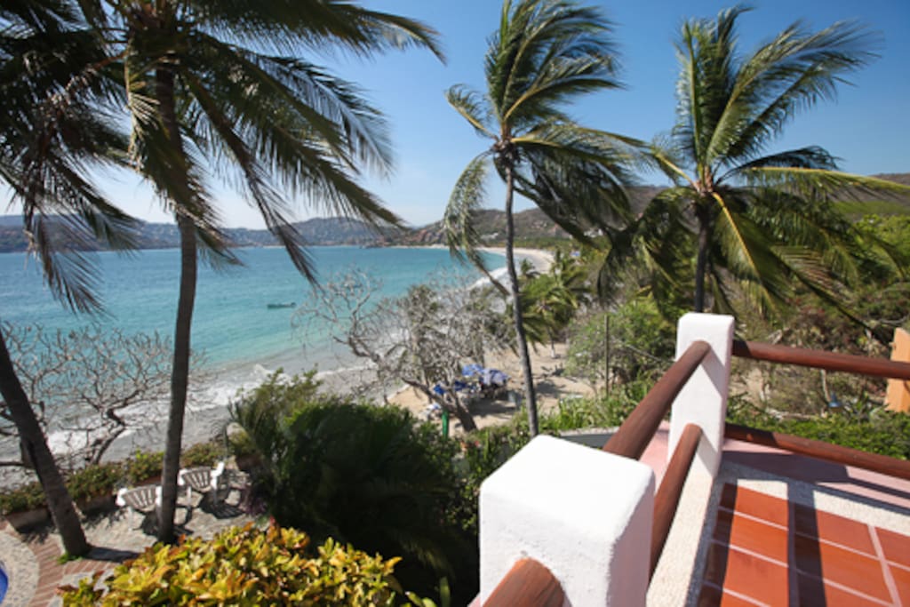 We're this close to the beach: the corner of our upper terrace and La Ropa beach, immediately below.
