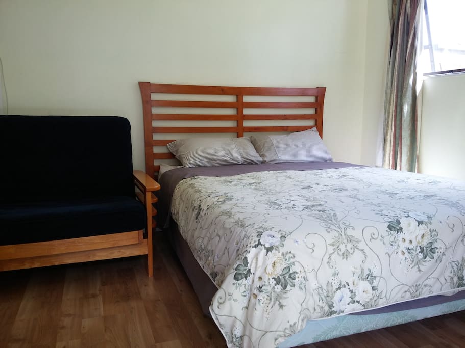 A queen bed plus couch bed