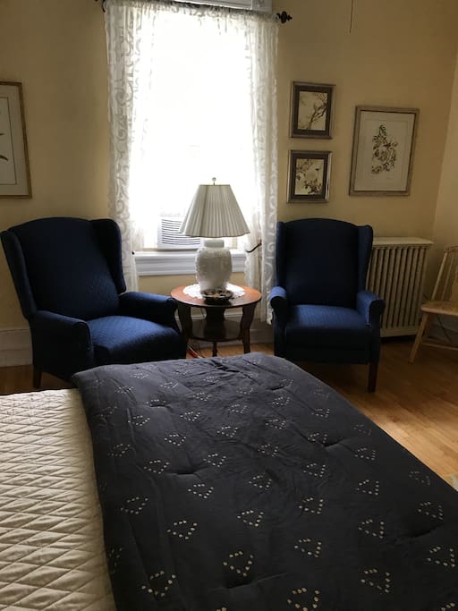 Seating area and desk included.