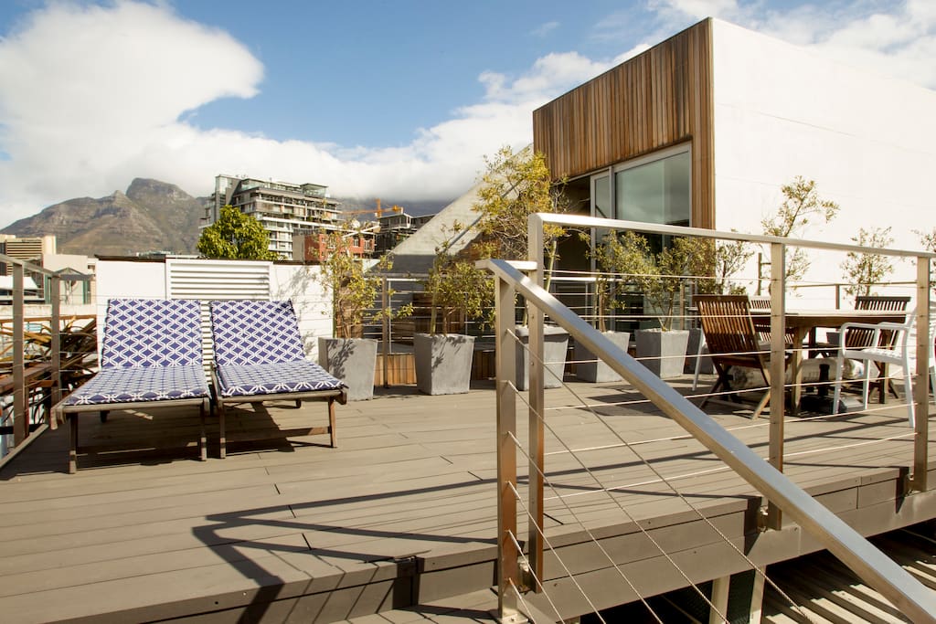Sunloungers on rooftop terrace