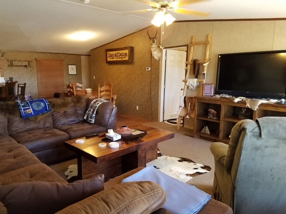 Main living room with dining room in the background