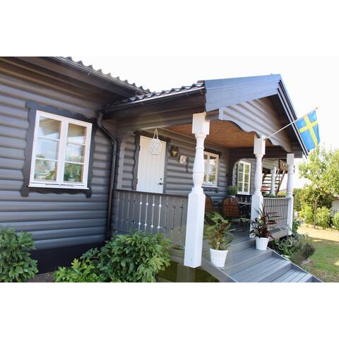 Classic and charming log house near the sea.