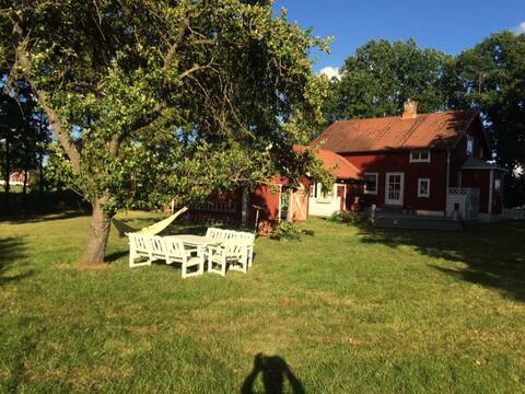 Holiday cottage with private dock and boat