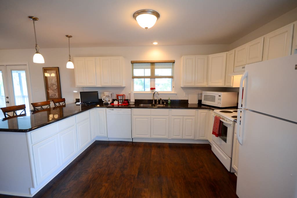 Full kitchen with dishwasher and microwave