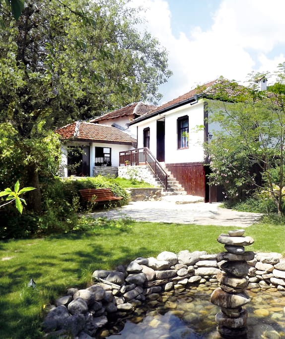 Front of property with water feature