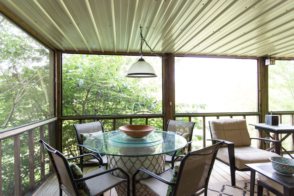 Private screened deck with hot tub and sauna.