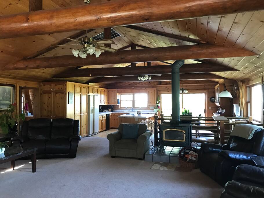 The main floor of the home consists of the living room, kitchen, dining area and game room. Pictured is the living room leading to the kitchen and dining area.