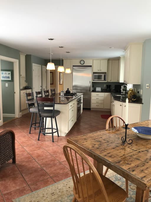 Large kitchen with granite countertops