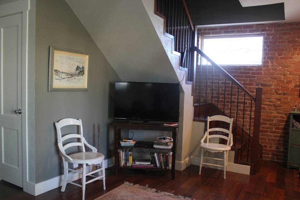 Exposed brick and large screen television with internet tv(Netflix, hulu, and etc). DVD player and some great movie choices!