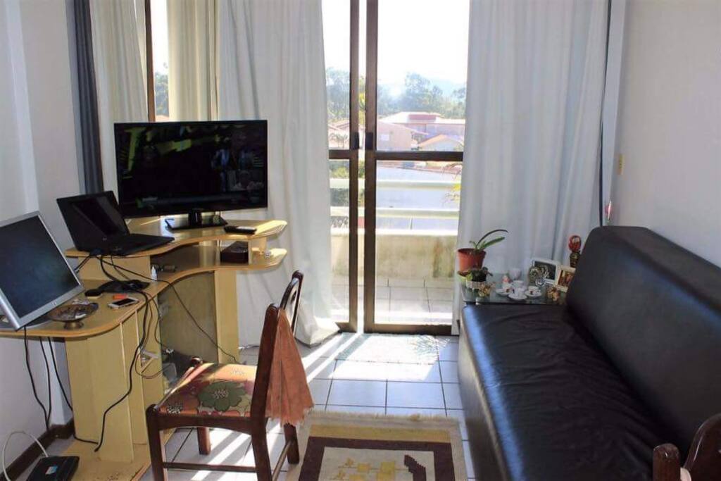 Sala com sofá cama