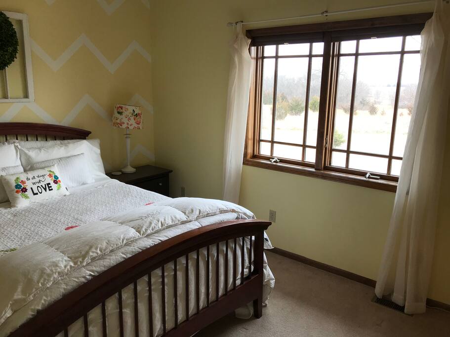 Queen size bed with 100% cotton sheets and a beautiful view from the window.