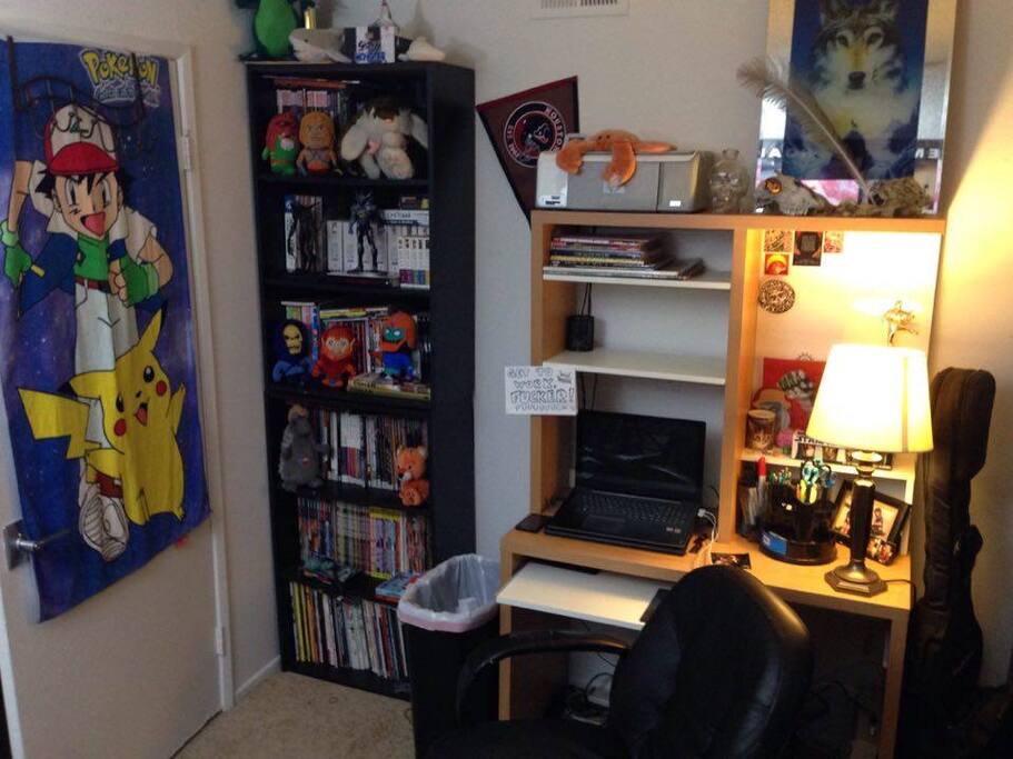 Computer desk and graphic novels. Feel free to read just, please, put them back when you're done.