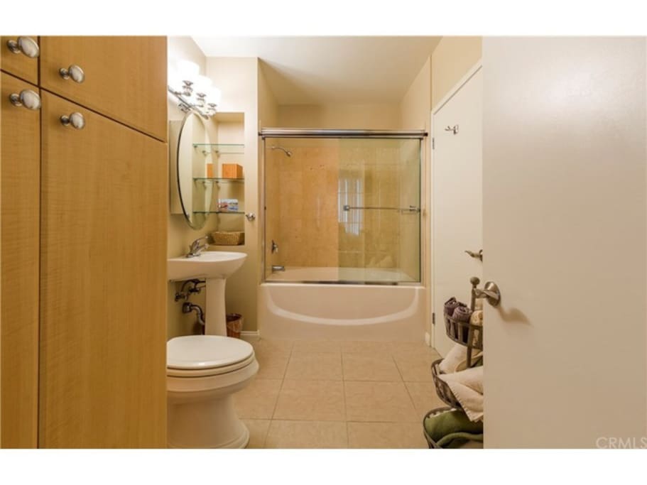 Beautiful updated bathroom with soaker tub directly accesses the bedroom as well as the hallway