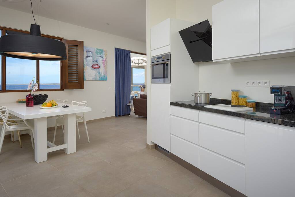 Kitchen with high-end appliances; mico-overcombi, dishwasher, fridge, cooktop, coffee maker, juicer, toaster..