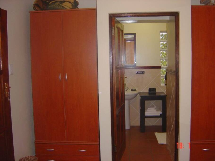 On suit bathroom with shower.