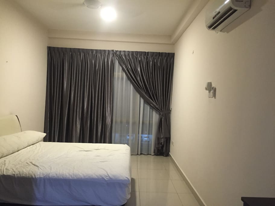 Master bedroom with king size bed and air conditioned.