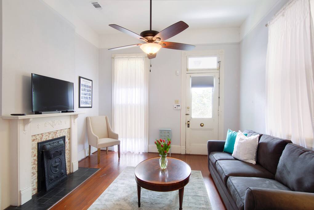Living room with queen sofa sleeper and flat screen tv.
