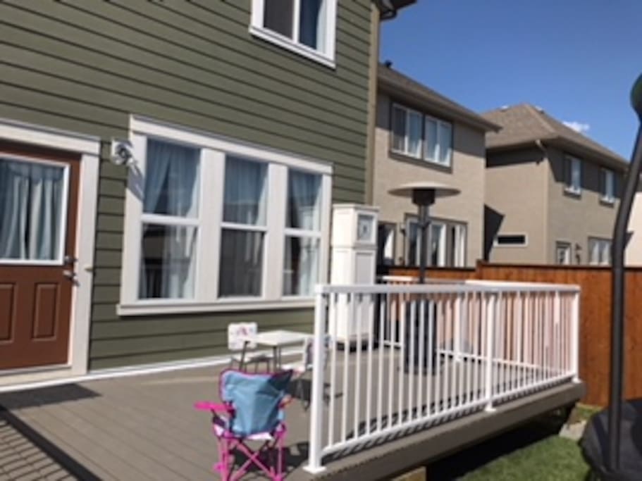 Large deck with heater and BBQ, trampoline for kids and cute little garden