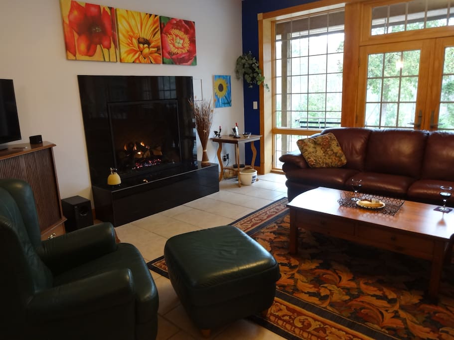 Living room with fireplace, nice views.