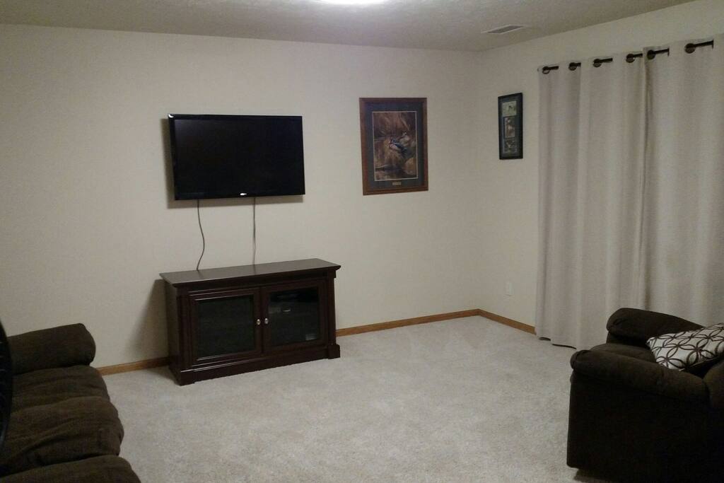 Flat screen TV with DirecTv. Recliner and sofa with reclining ends.