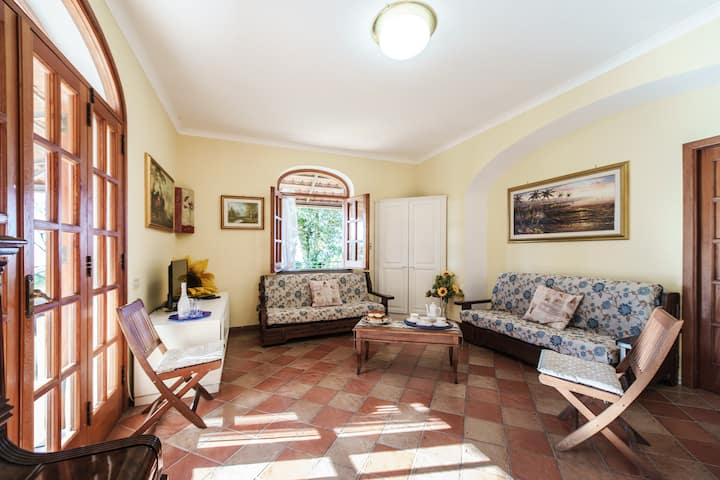 The sitting room/lounge area. This is complemented by comfortable outdoor lounges on the terrace, accessed through wide doors.