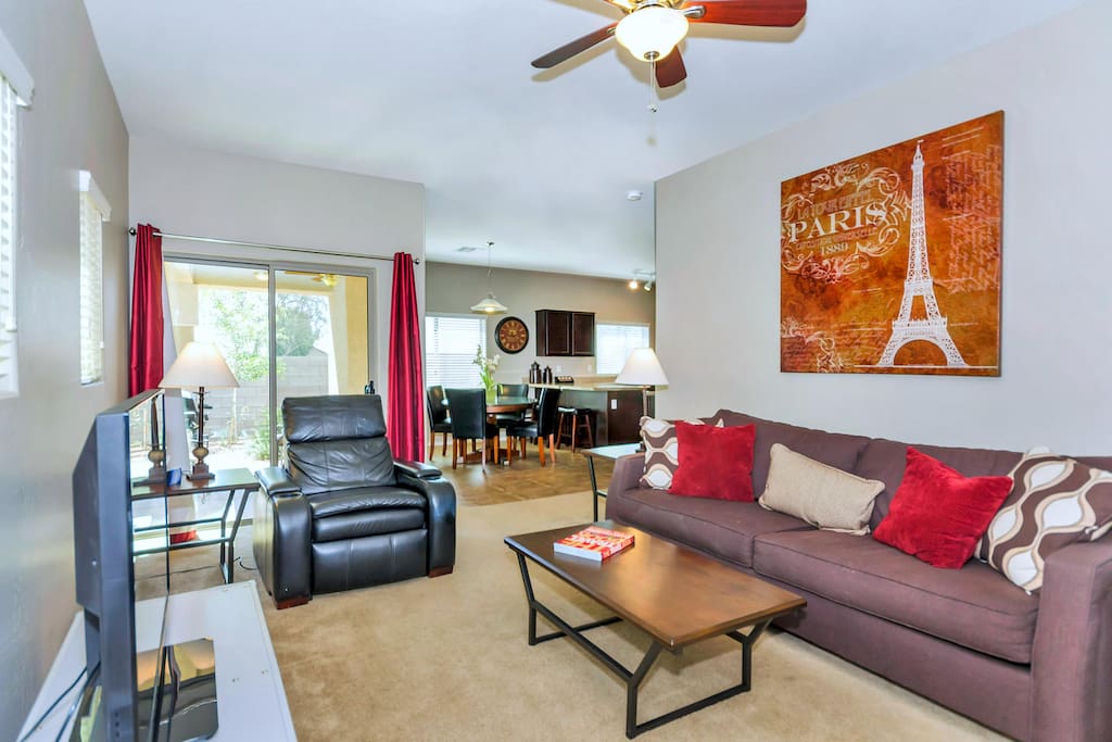 Family room with large flat screen TV with Direct TV and queen sized convertible couch