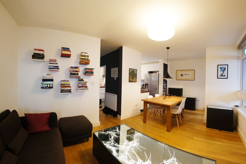 Generous living area with comfortable sofa and separate dining area. Plenty of books to read!