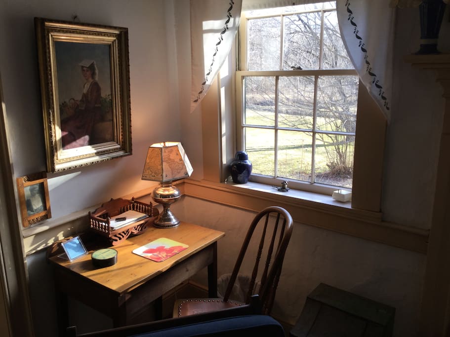 Evening sunlight on table and chair, looking out to the yard.