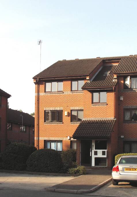 Front entrance and parking space