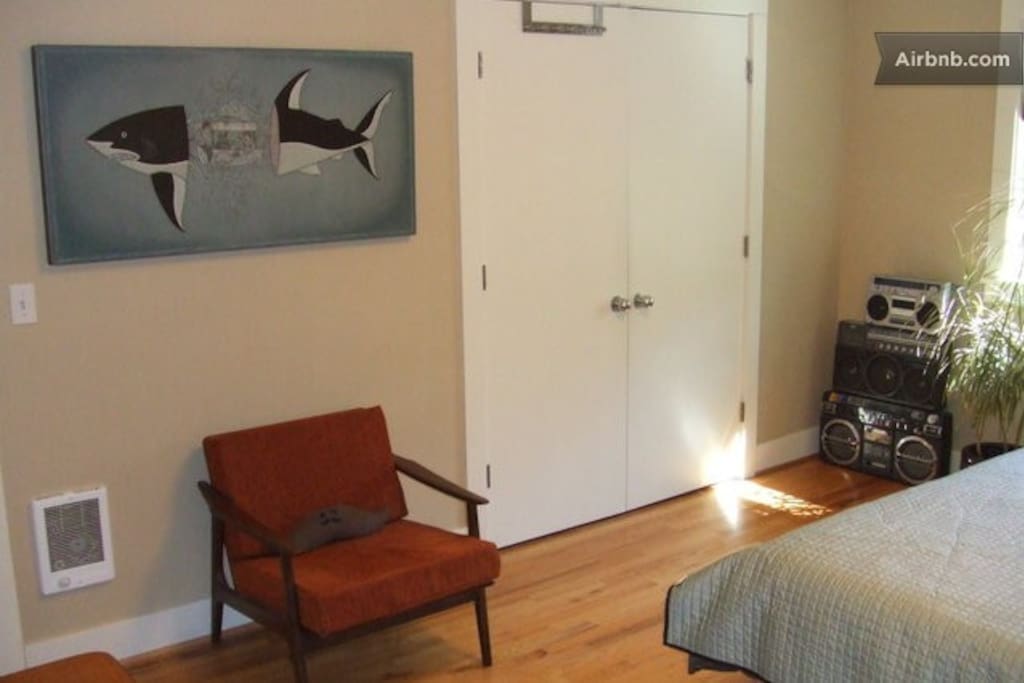Painting by local artist, a comfy chair, full closet...and a tower of boom boxes? Yup!