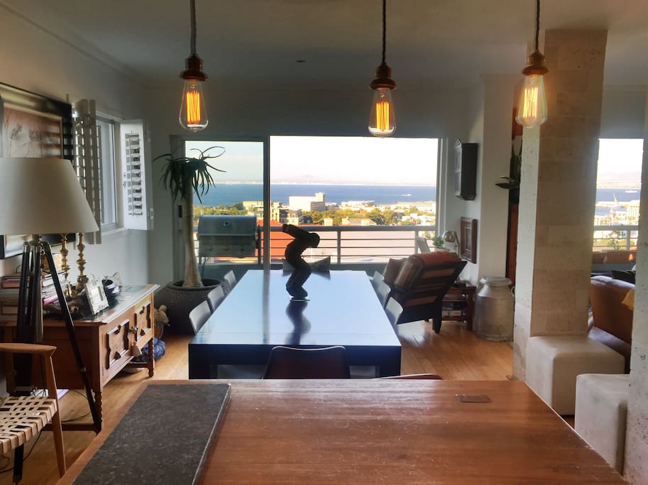 Dining room, opening onto small balcony with BBQ.