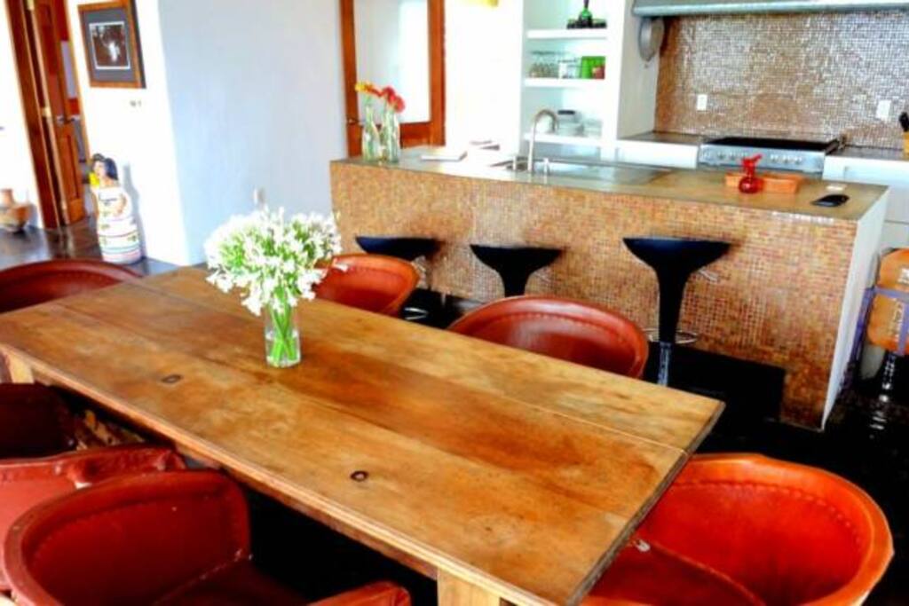 Breakfast bar and open concept kitchen/dining/living areas