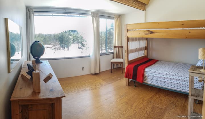 Vincent Van Gogh bedroom upstairs with bunk beds.