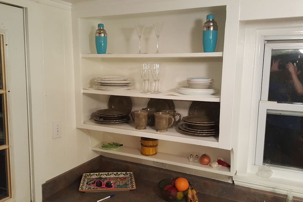 Kitchen comes equipped with all types of plates and glassware, ready-made for hosting.