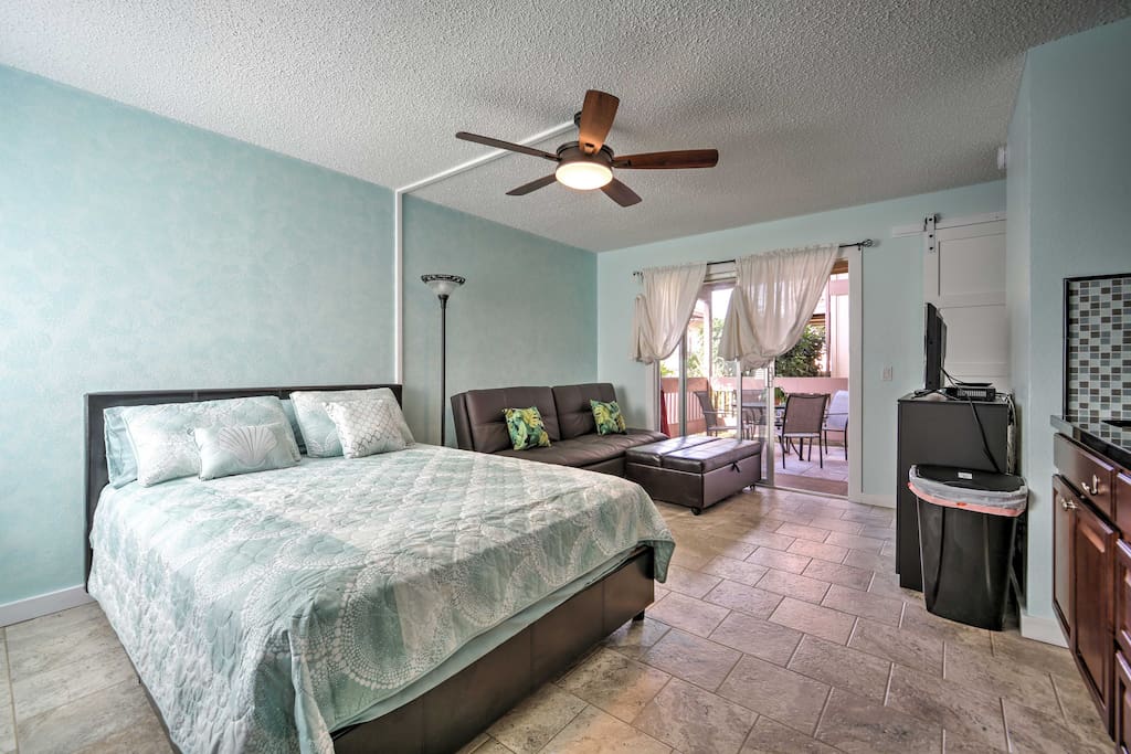 The lovely home is freshly painted in soft hues of light blues and greens.
