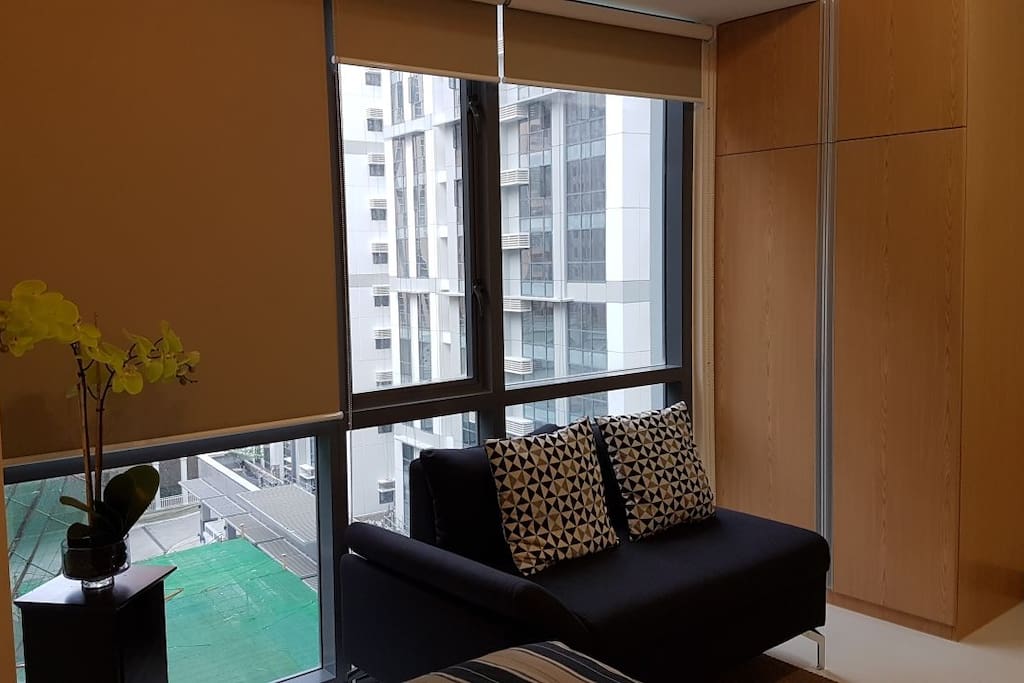 The double couch for a homey feel while looking outside or reading a good book.