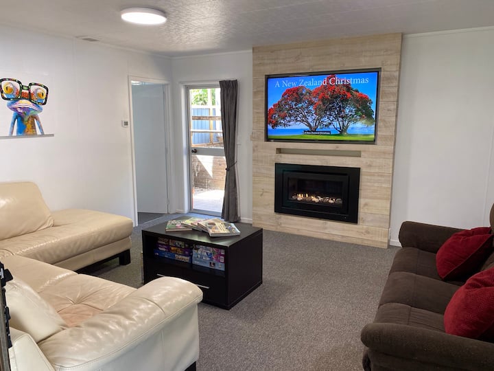 Downstairs media room with gas fireplace.  Perfect for cosy movie nights.  Or if you're more old-school, break out the chess set or play charades!