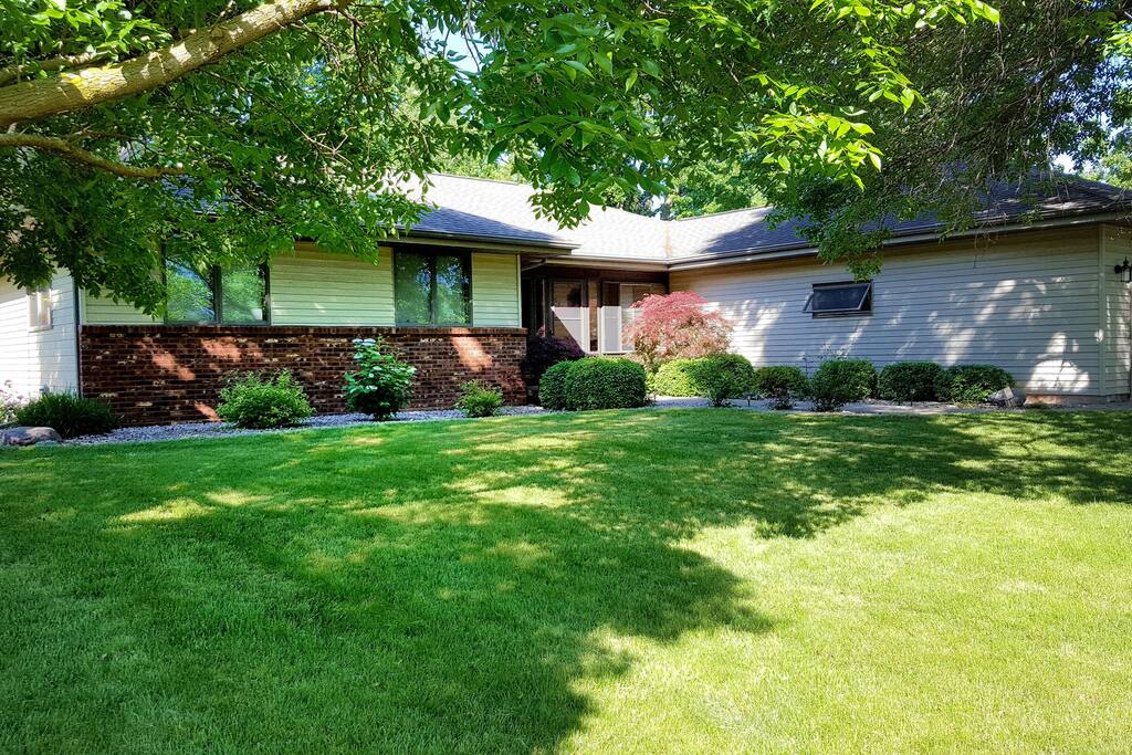 Screened in front porch and rose lined walkway to your front door. 2.5 car garage with plenty of extra parking in the driveway!