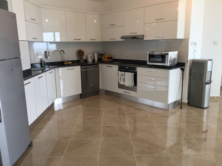 Fully fitted Kitchen with Microwave Oven, Bottled Water Dispenser