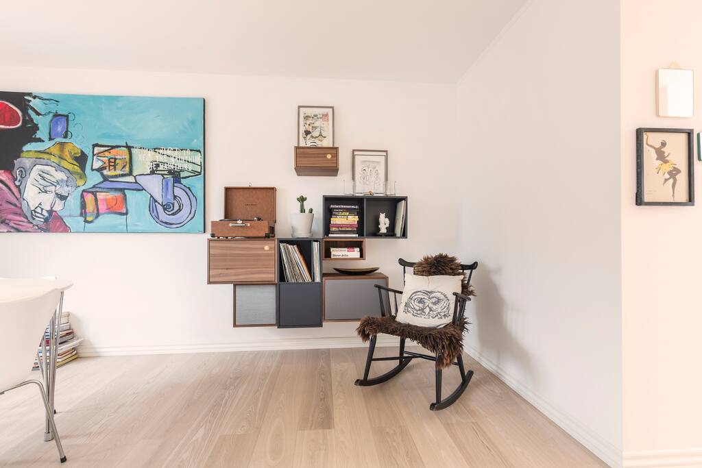 Part of dining room with rocking chair