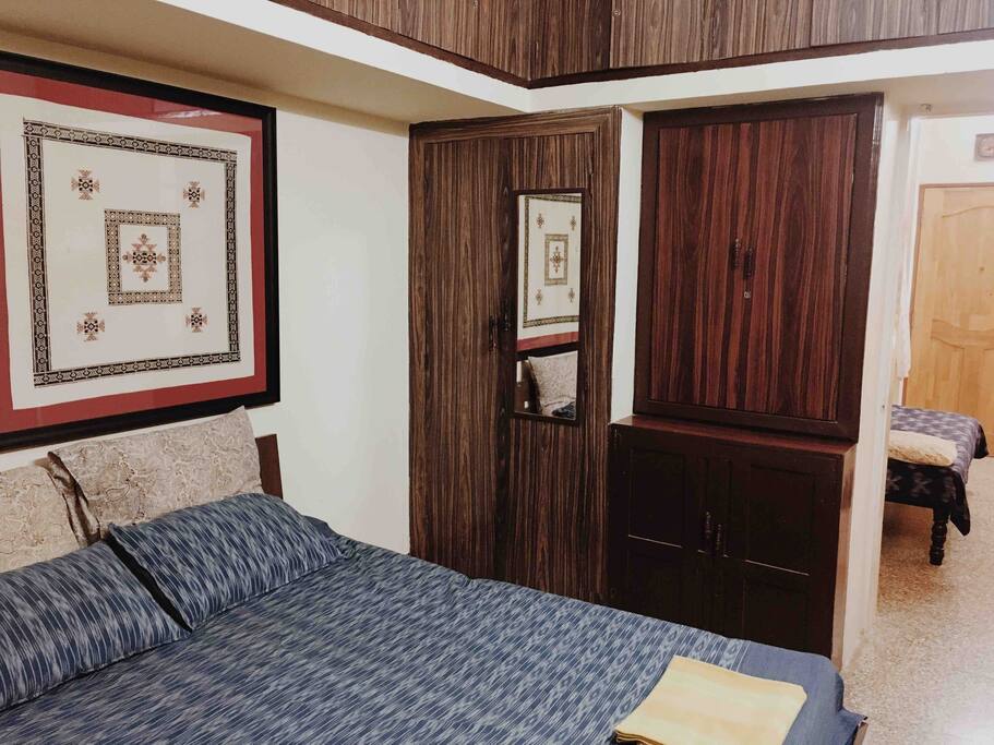 Bedroom with double bed and ample cupboard storage