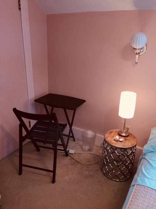 Folding chair and table are behind the door in case you need a little desk space to work on a computer.