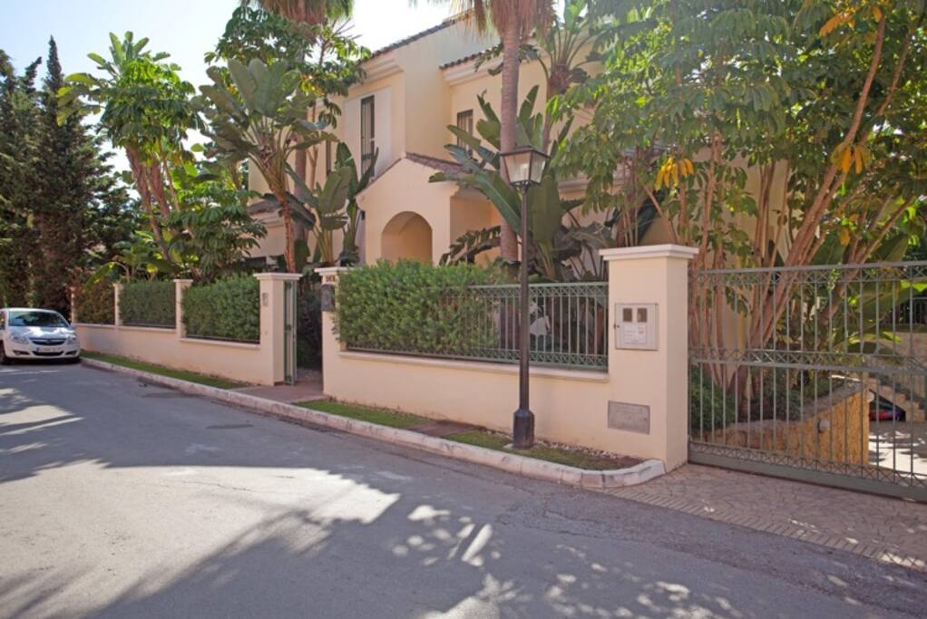 Front of Villa with Street Parking & Gate to 2 Car Garage